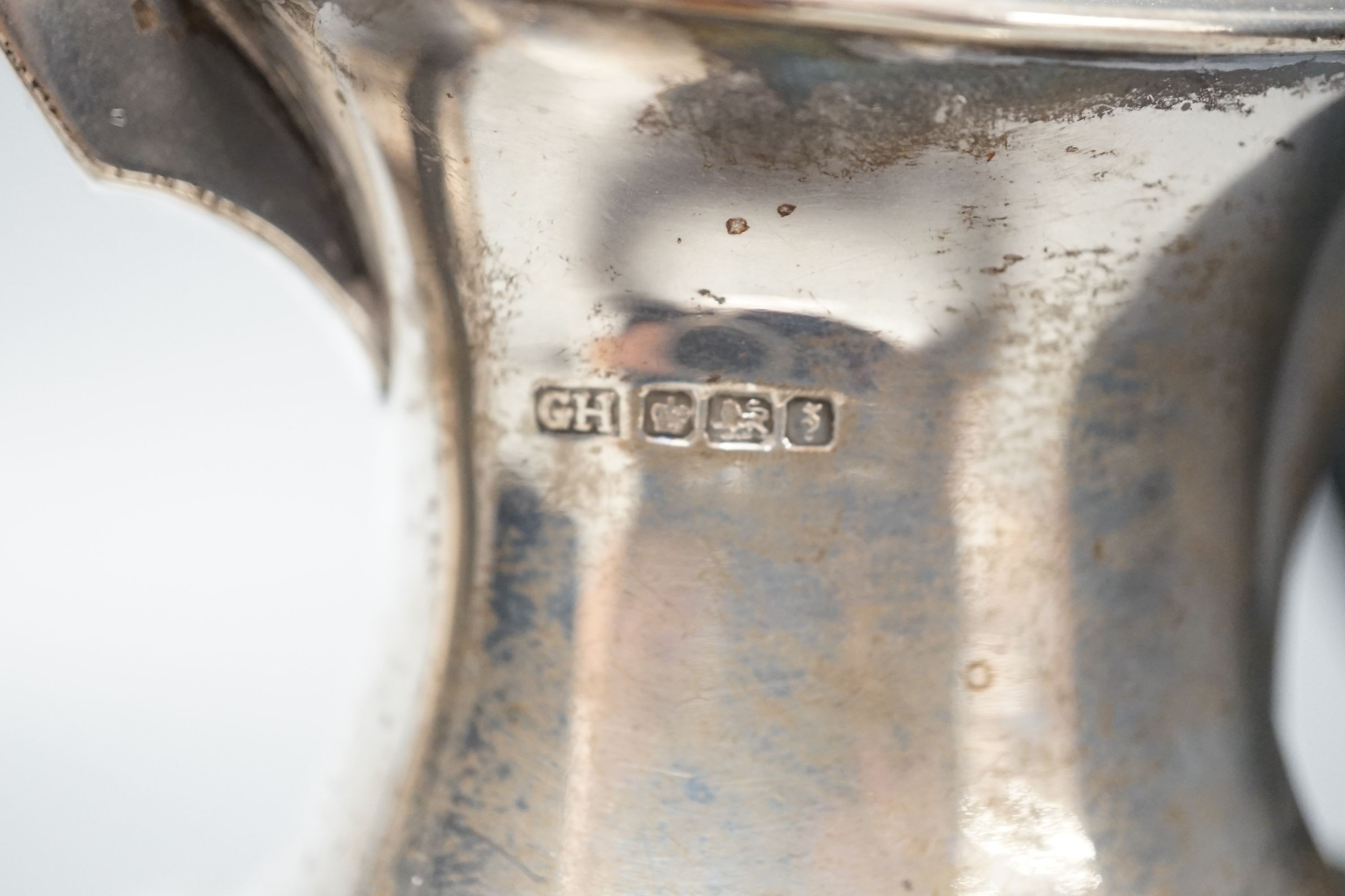 Two George V silver hot water pots, gross 39oz.
